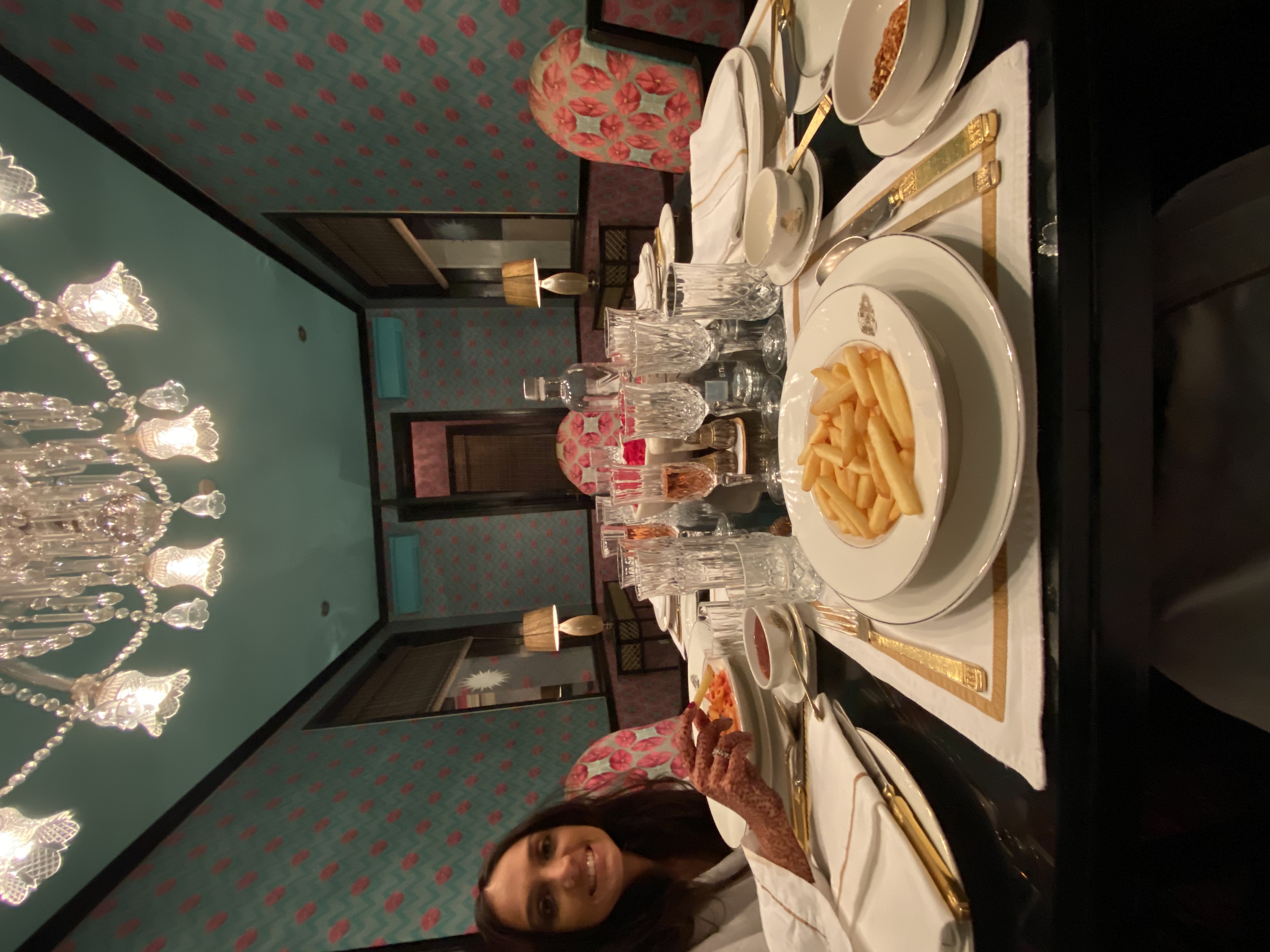 Private dining in the Maharani Suite with crystal chandelier and gold cutlery